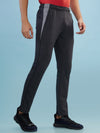 Hint track pant with side panel and piping and side pockets with zippers on both side with self fabric elasticated waistband with draw cord