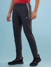 Hint track pant with side panel and piping and side pockets with zippers on both side with self fabric elasticated waistband with draw cord