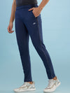 Hint track pant with side panel and piping and side pockets with zippers on both side with self fabric elasticated waistband with draw cord