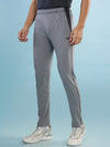 Hint track pant with side panel and piping and side pockets with zippers on both side with self fabric elasticated waistband with draw cord