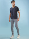 Hint track pant with side panel and piping and side pockets with zippers on both side with self fabric elasticated waistband with draw cord