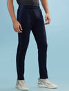 Hint track pant with side panel and piping and side pockets with zippers on both side with self fabric elasticated waistband with draw cord