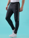 Hint Track pant with side tapping and side pockets with zippers on both side with self fabric elasticatedwaistband with draw cord