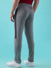 Hint Track pant with side tapping and side pockets with zippers on both side with self fabric elasticatedwaistband with draw cord